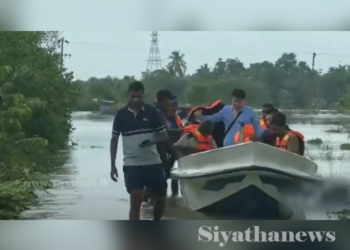 චීන ජාතිකයින් දෙදෙනෙක් ඇතුළු හත්දෙනෙක් ගංවතුරට කොටුවී සිටියදී බේරාගනී (VIDEO)