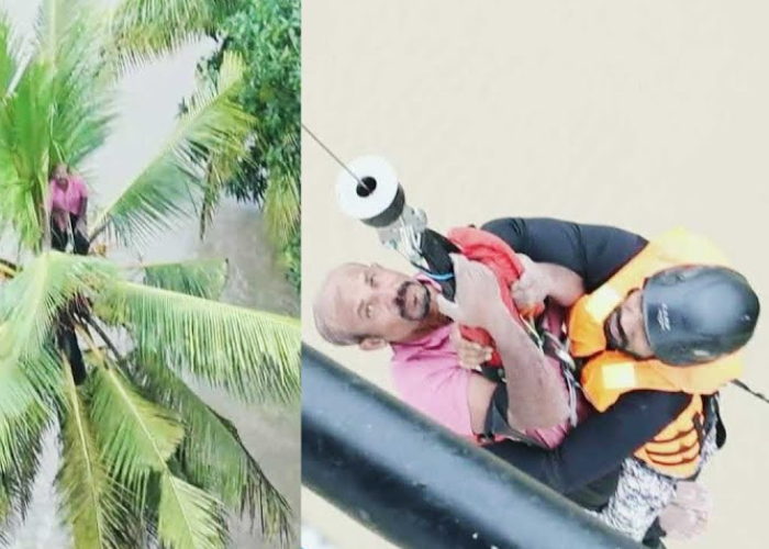 ගංවතුර තත්ත්වයෙන් පොල්ගසක් මත සිරවී සිටි පුද්ගලයෙක් බේරාගත් මෙහෙයුම (VIDEO)